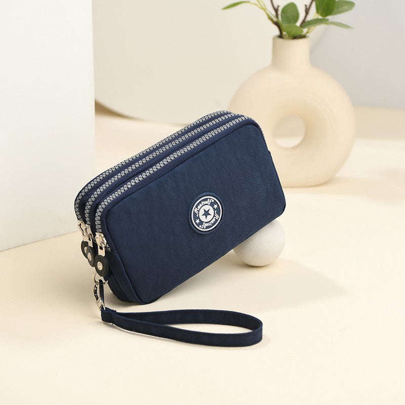 The 3-layer zipper clutch is lightweight, compact and versatile for ladies. It can be used with mobile phones or loose change