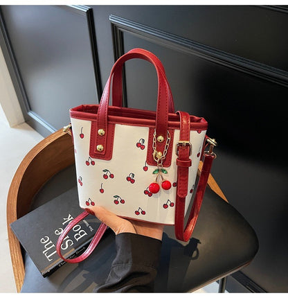 Women PU Cherry Shoulder Bag Large Capacity Trendy Commuting Bag with Cherry Pendant Stylish Crossbody Bag Aesthetic Handbag
