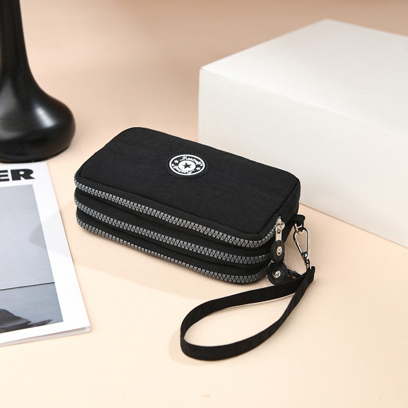 The 3-layer zipper clutch is lightweight, compact and versatile for ladies. It can be used with mobile phones or loose change