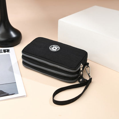 The 3-layer zipper clutch is lightweight, compact and versatile for ladies. It can be used with mobile phones or loose change