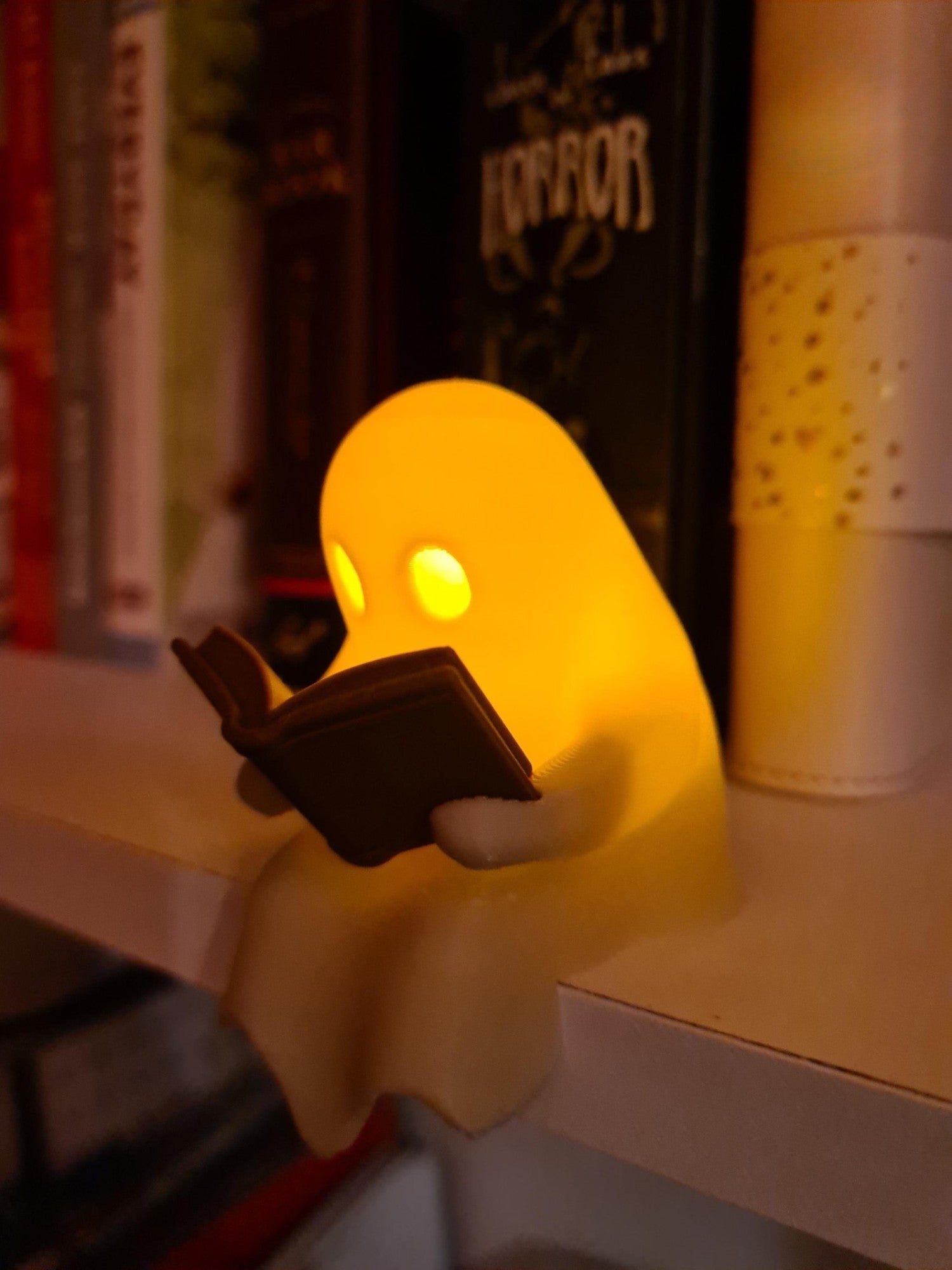 Halloween Party Decoration Favors Cute Little Ghost Sitting on A Shelf Reading A Book with Flickering Ornament Gift Spooky Idea