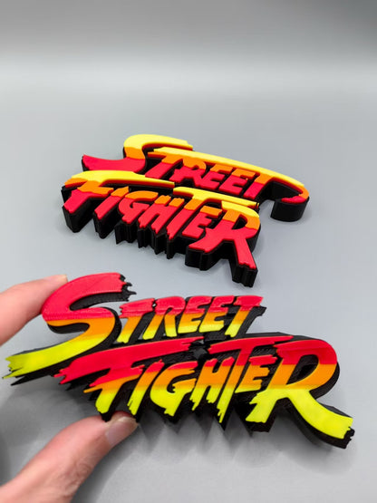 Street Fighter, Street Fighter (abbreviation), arcade game, Street Fighter Logo, signboard, action figure, ornament.