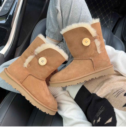 A pair of pure sheepskin and wool winter snow boots for women, warm and comfortable. Simple and fashionable women's shoes
