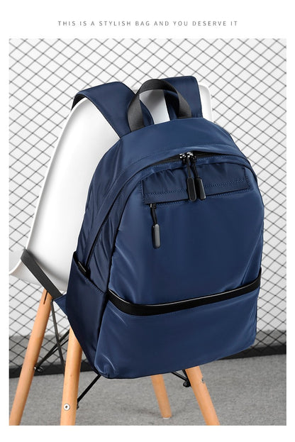 Mochila de negócios masculina de novo estilo, nylon, cor sólida, grande capacidade, mochila escolar para estudantes, mochila de viagem em promoção