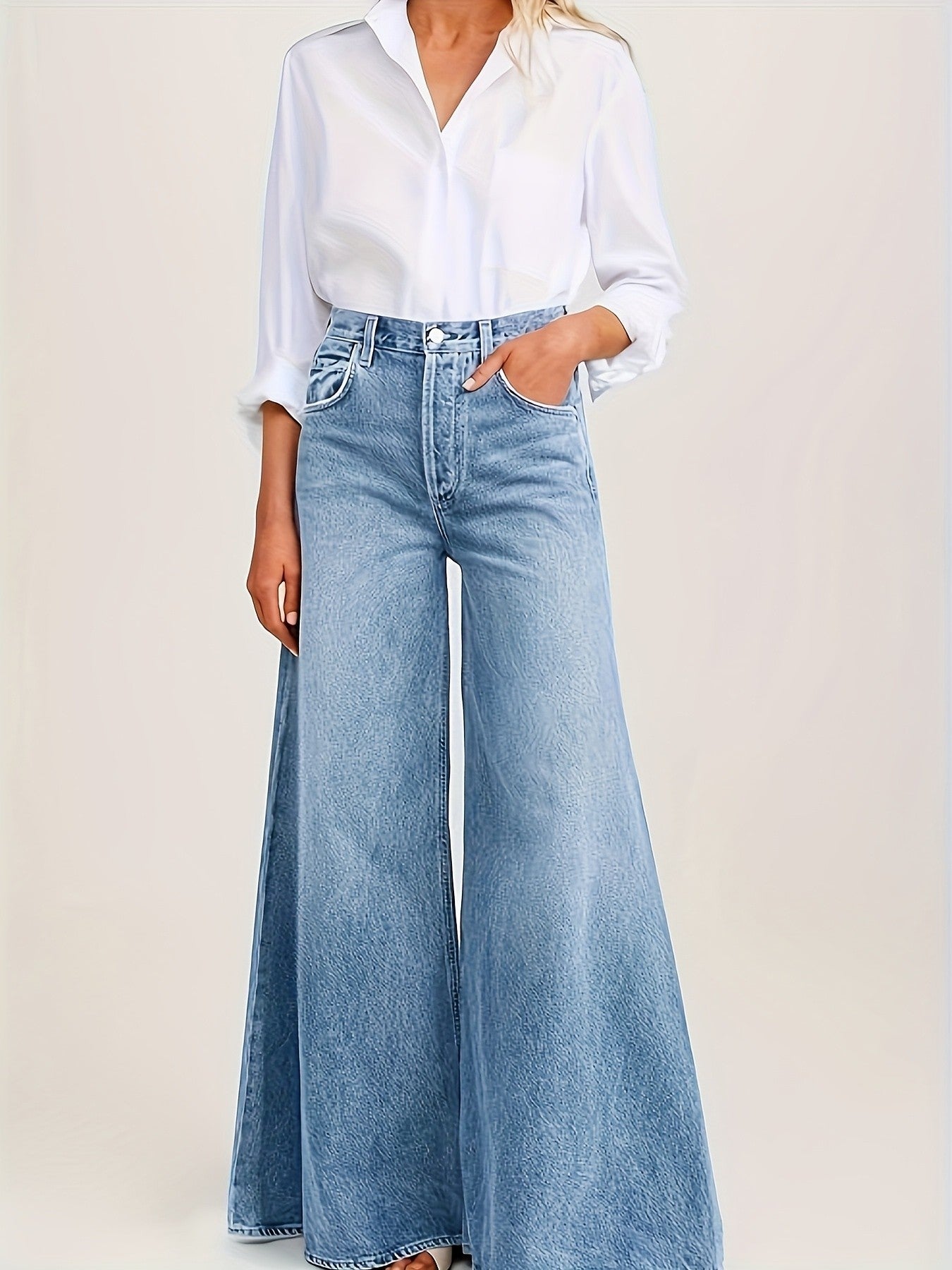 High-waisted light blue faded loose A-line wide-leg women's jeans