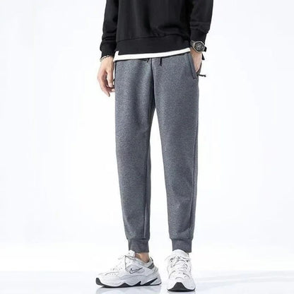2025 New Men Loose Sweatpants Casual Elastic Drawstring Pants Male Elastic Waist Soft Casual Ankle Band Zipper Pockets Trousers