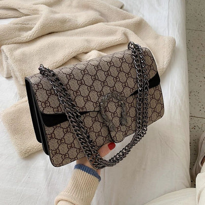 Retro PU women's crossbody bag with magnetic snap button, lightweight shoulder bag and multi compartment daily essentials