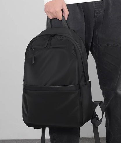 Mochila de negócios masculina de novo estilo, nylon, cor sólida, grande capacidade, mochila escolar para estudantes, mochila de viagem em promoção