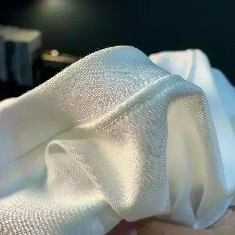 Roupas masculinas Unissex Tendência de verão Moda Marca de luxo Camiseta com letras estampadas Camiseta de algodão masculina e feminina Manga curta