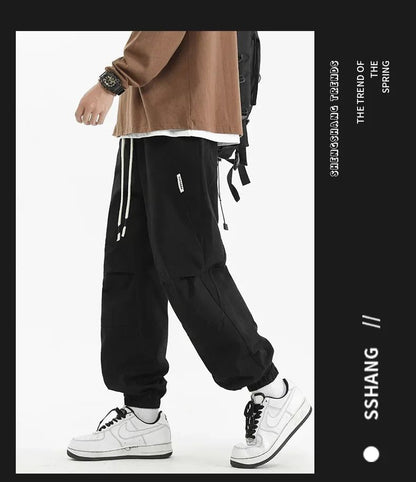 Calça Jogger Solta Multibolsos para Primavera Verão, Calça Casual Masculina Estilo Urbano com Cordão na Cintura, Calça Cargo para Fitness e Atividades ao Ar Livre