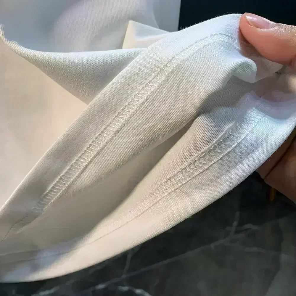 Roupas masculinas Unissex Tendência de verão Moda Marca de luxo Camiseta com letras estampadas Camiseta de algodão masculina e feminina Manga curta