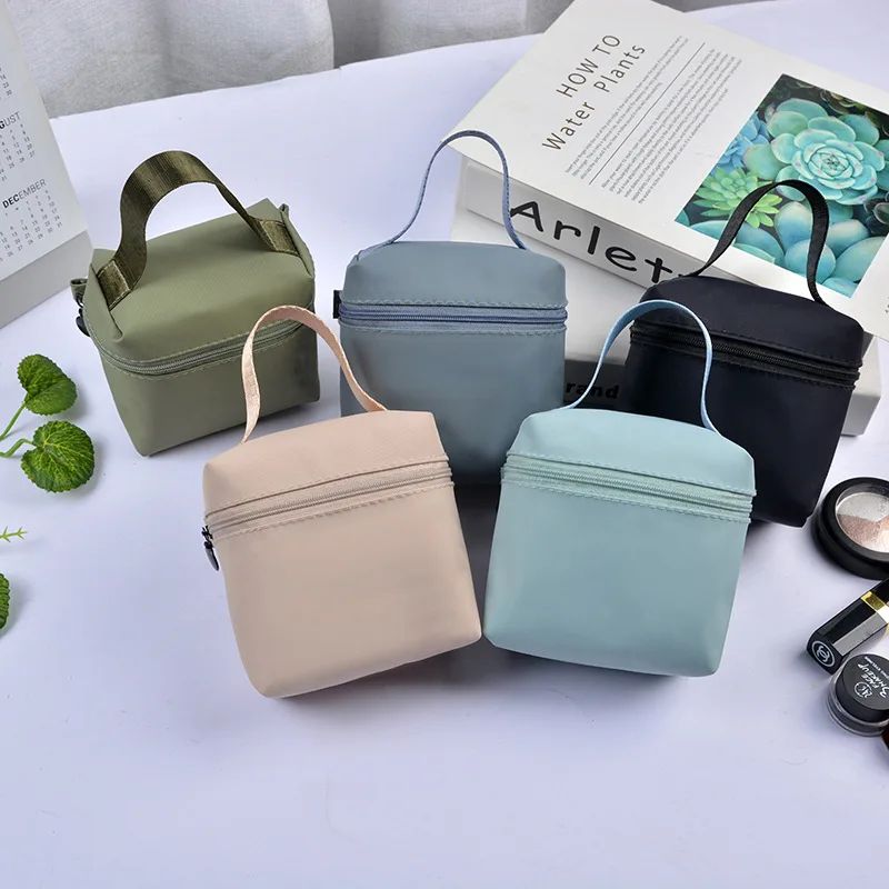 Top selling high-end portable waterproof handle makeup bag, lipstick storage bag, headphone pouch, mini menstrual towel bag