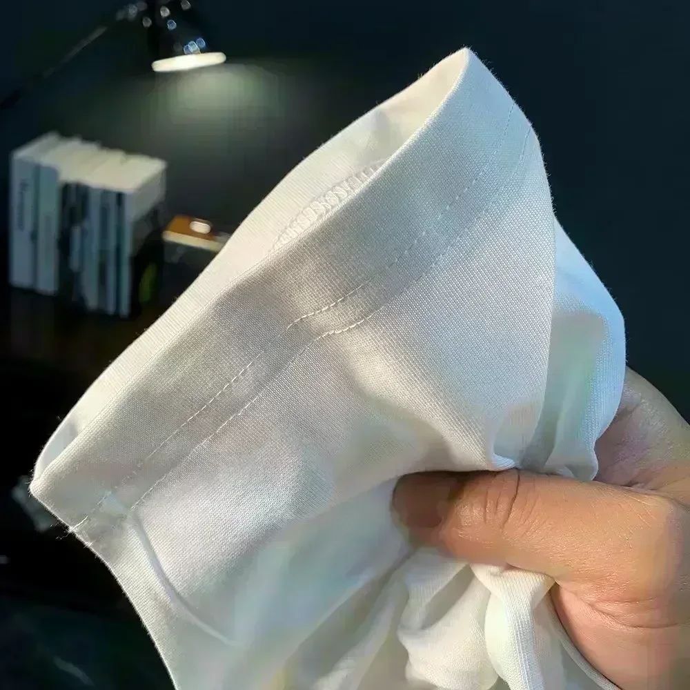 Roupas masculinas Unissex Tendência de verão Moda Marca de luxo Camiseta com letras estampadas Camiseta de algodão masculina e feminina Manga curta