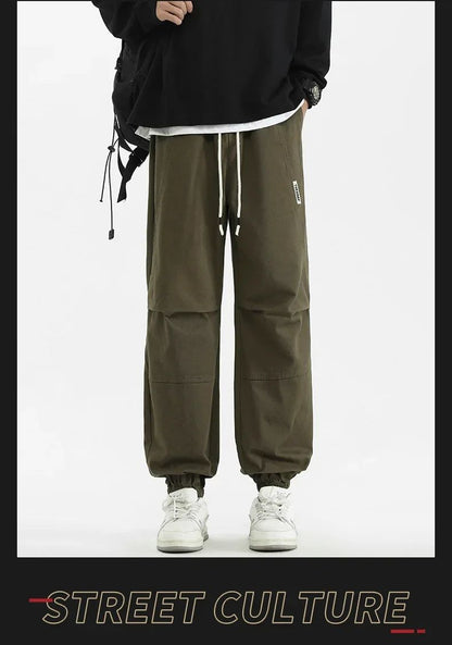 Calça Jogger Solta Multibolsos para Primavera Verão, Calça Casual Masculina Estilo Urbano com Cordão na Cintura, Calça Cargo para Fitness e Atividades ao Ar Livre