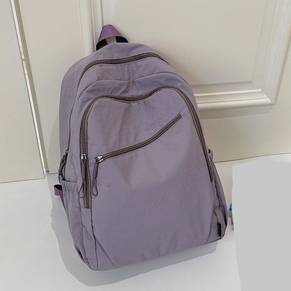 Backpack, large capacity, adjustable shoulder straps, suitable for school, campus travel, and work, with a secure zipper closure