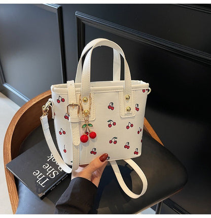 Women PU Cherry Shoulder Bag Large Capacity Trendy Commuting Bag with Cherry Pendant Stylish Crossbody Bag Aesthetic Handbag