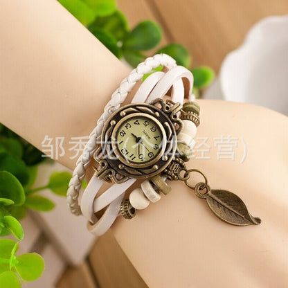 Foreign trade hot selling retro cowhide wrapped bracelet watch, ladies' delicate watch, leaf and leaf pendant decoration, studen