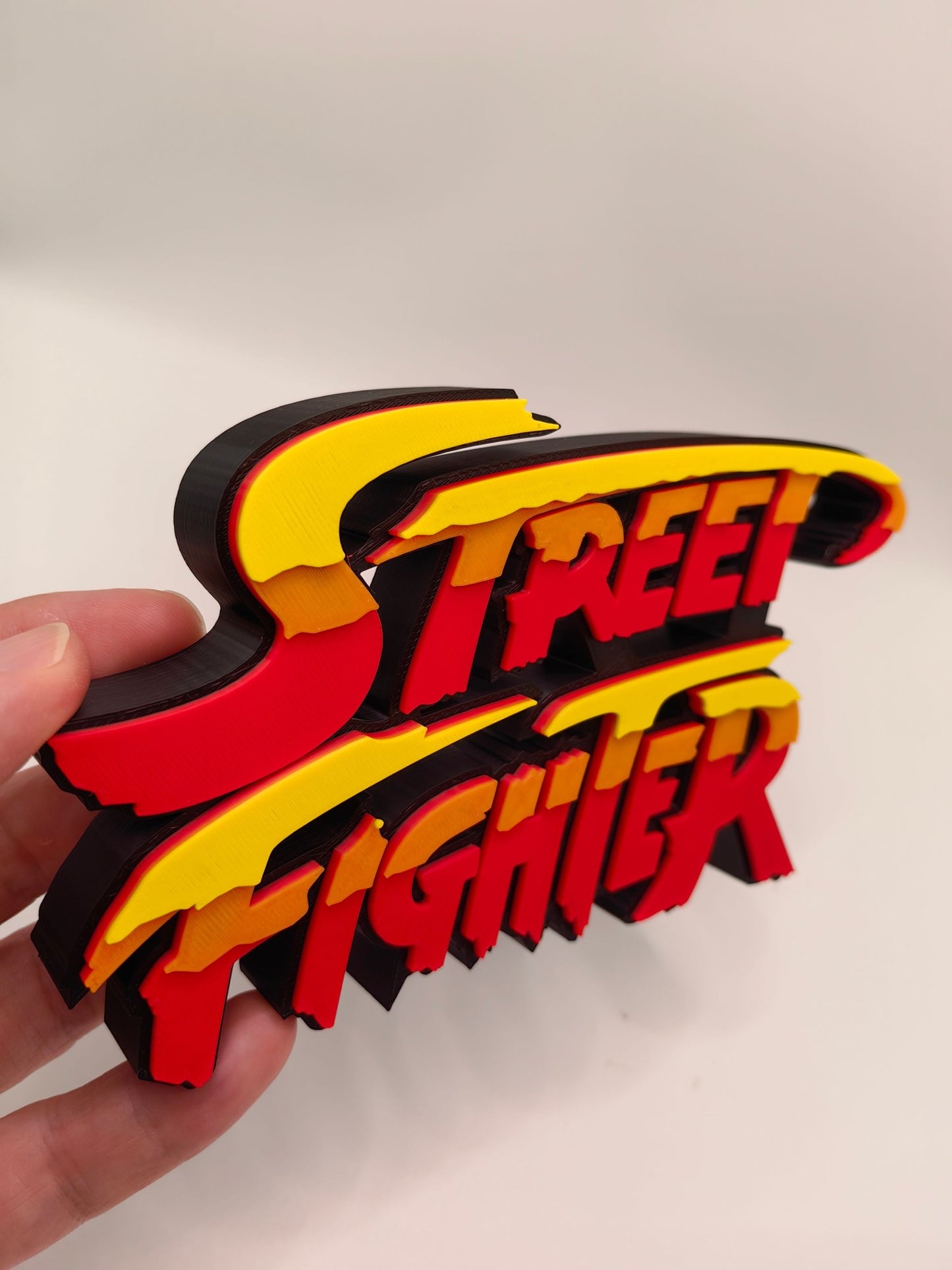 Street Fighter, Street Fighter (abbreviation), arcade game, Street Fighter Logo, signboard, action figure, ornament.