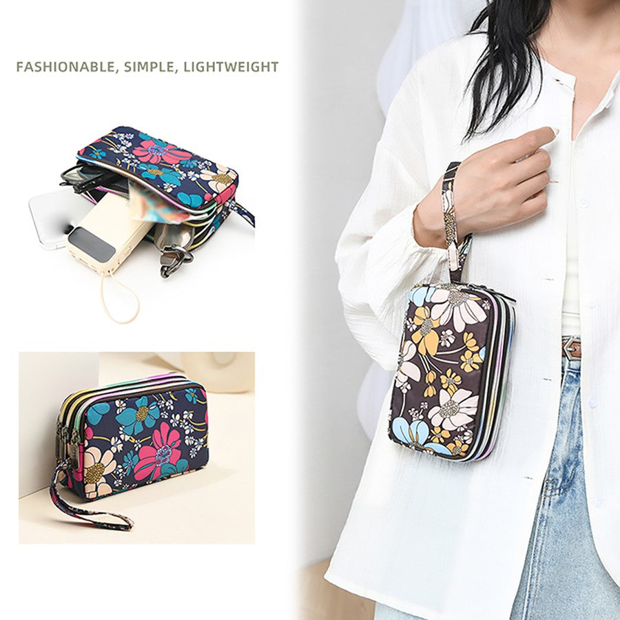 The fashionable lady's clutch and mobile phone bag are rich in floral patterns and elements, and the fabric is soft