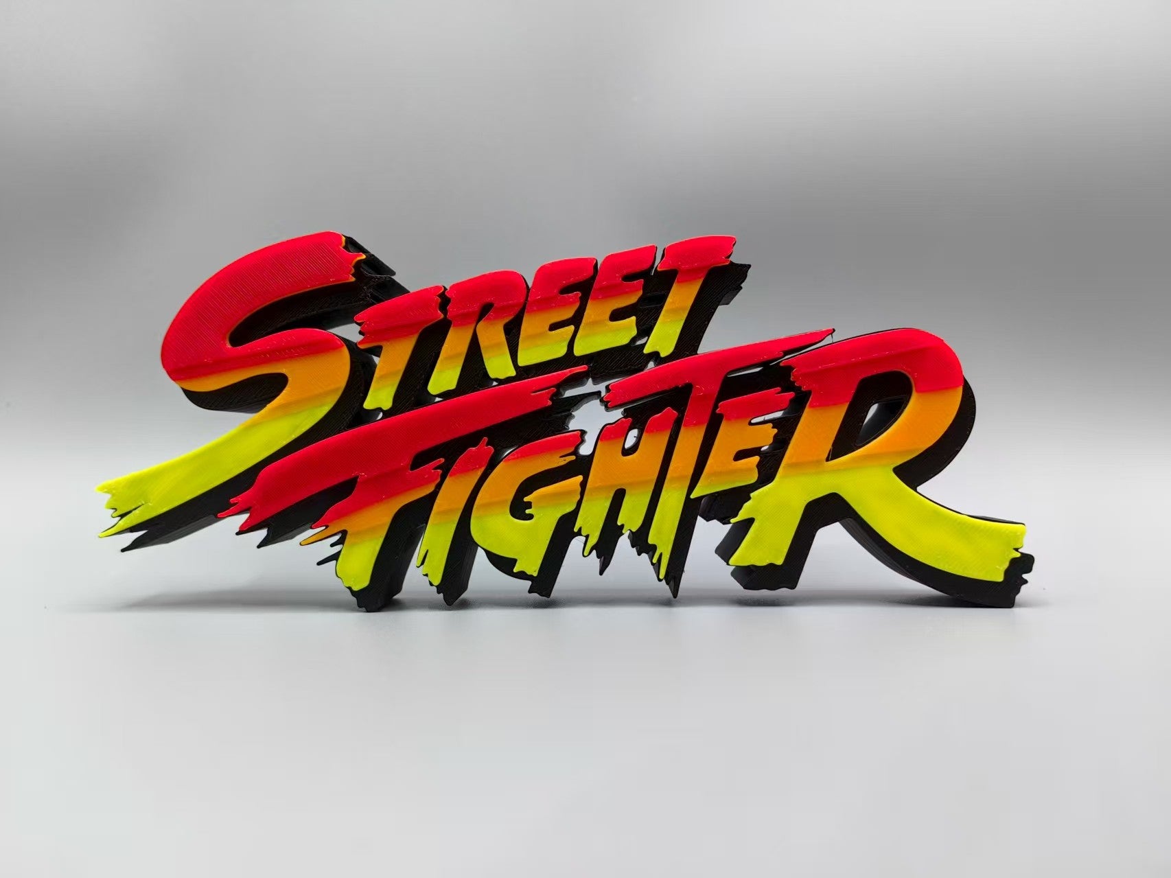 Street Fighter, Street Fighter (abbreviation), arcade game, Street Fighter Logo, signboard, action figure, ornament.
