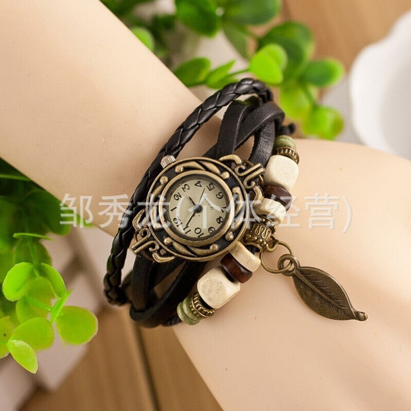 Foreign trade hot selling retro cowhide wrapped bracelet watch, ladies' delicate watch, leaf and leaf pendant decoration, studen