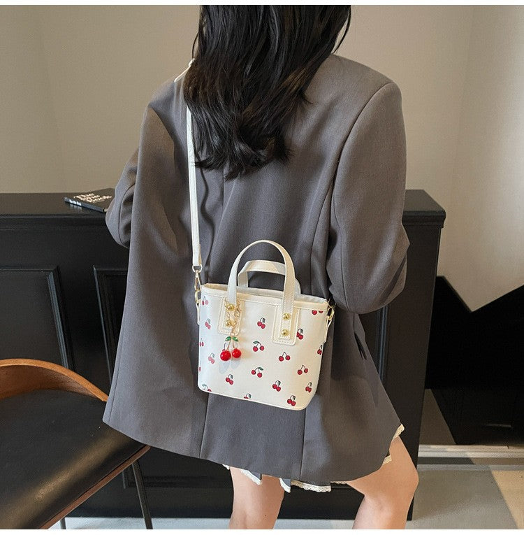 Women PU Cherry Shoulder Bag Large Capacity Trendy Commuting Bag with Cherry Pendant Stylish Crossbody Bag Aesthetic Handbag