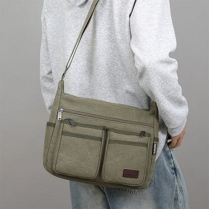 Neutral business casual crossbody bag - adjustable shoulder straps, multiple zippered compartments, durable black polyester lini