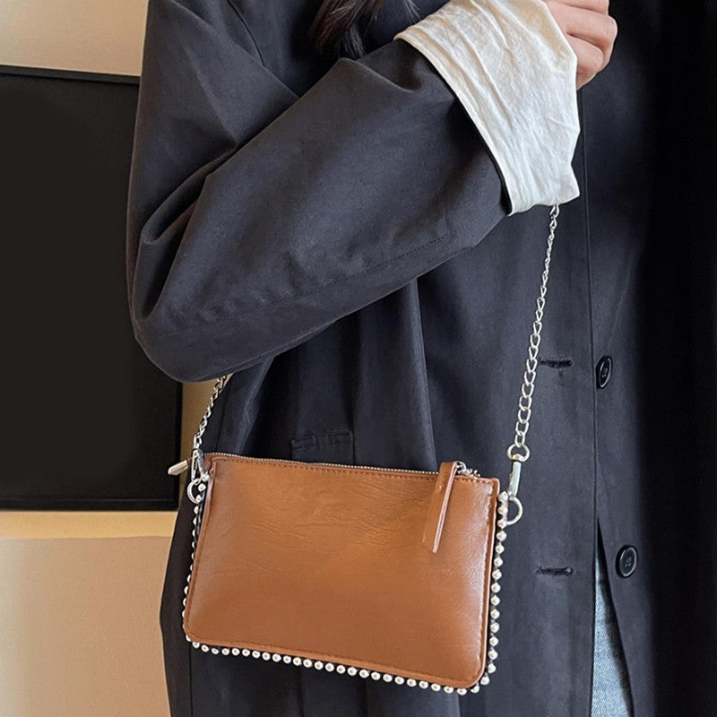 Women's retro classic bead chain design elegant and exquisite crossbody bag solid color commuting envelope bag.