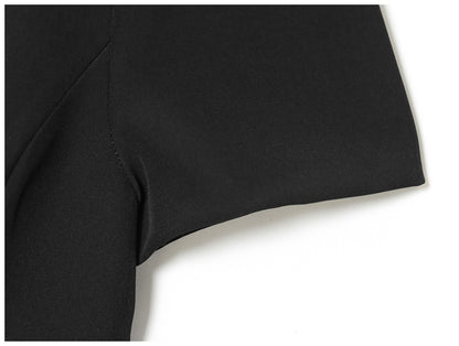 Women's black short puff sleeve mini dress with a stylish boat neckline design and pocket details, suitable for elegant occasion