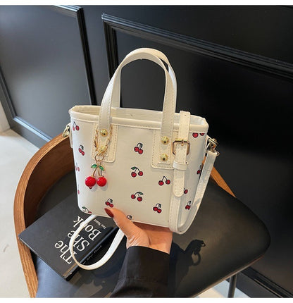 Women PU Cherry Shoulder Bag Large Capacity Trendy Commuting Bag with Cherry Pendant Stylish Crossbody Bag Aesthetic Handbag