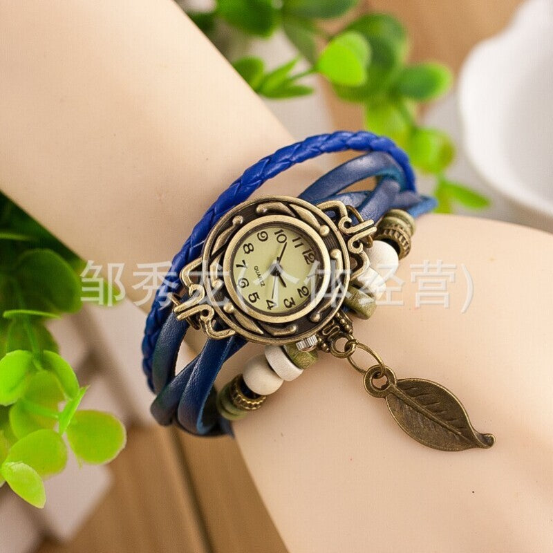 Foreign trade hot selling retro cowhide wrapped bracelet watch, ladies' delicate watch, leaf and leaf pendant decoration, studen