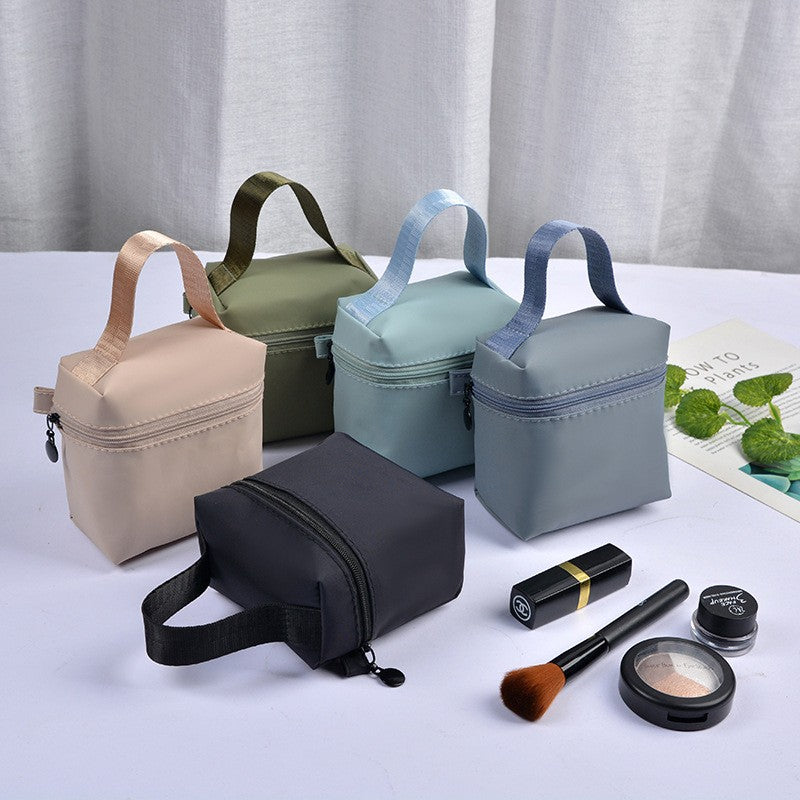 Top selling high-end portable waterproof handle makeup bag, lipstick storage bag, headphone pouch, mini menstrual towel bag