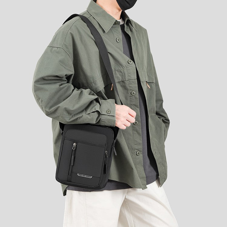 1 men's crossbody bag with zip closure, adjustable shoulder strap, and multiple storage compartments, suitable for daily commuti