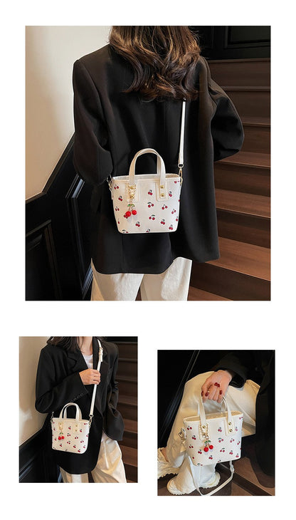 Women PU Cherry Shoulder Bag Large Capacity Trendy Commuting Bag with Cherry Pendant Stylish Crossbody Bag Aesthetic Handbag