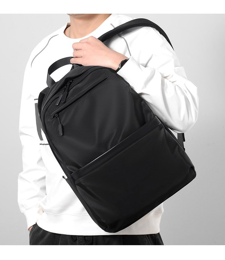 Mochila de negócios masculina de novo estilo, nylon, cor sólida, grande capacidade, mochila escolar para estudantes, mochila de viagem em promoção