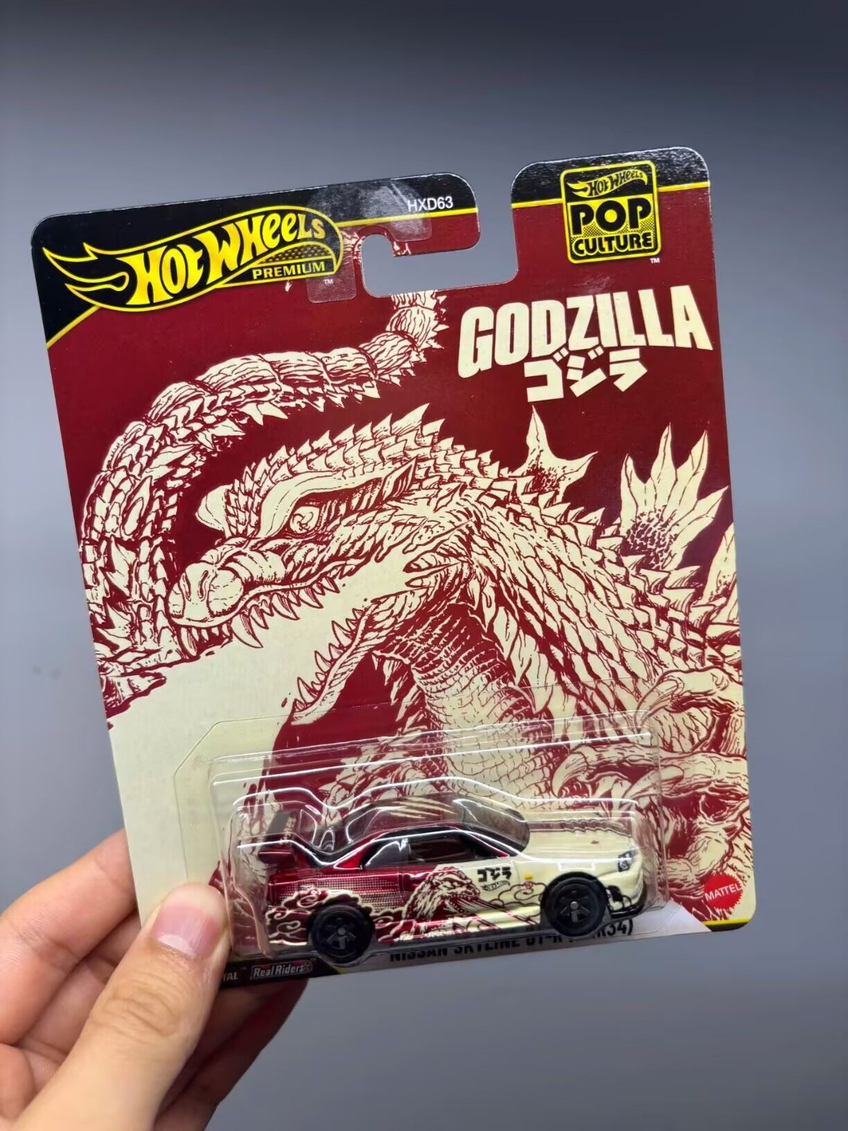 Hot Wheels Premium Carro de Cultura Pop Escala 1/64 - Nissan Skyline Gt-R Godzilla - Brinquedo Colecionável Para Meninos Presente de Natal