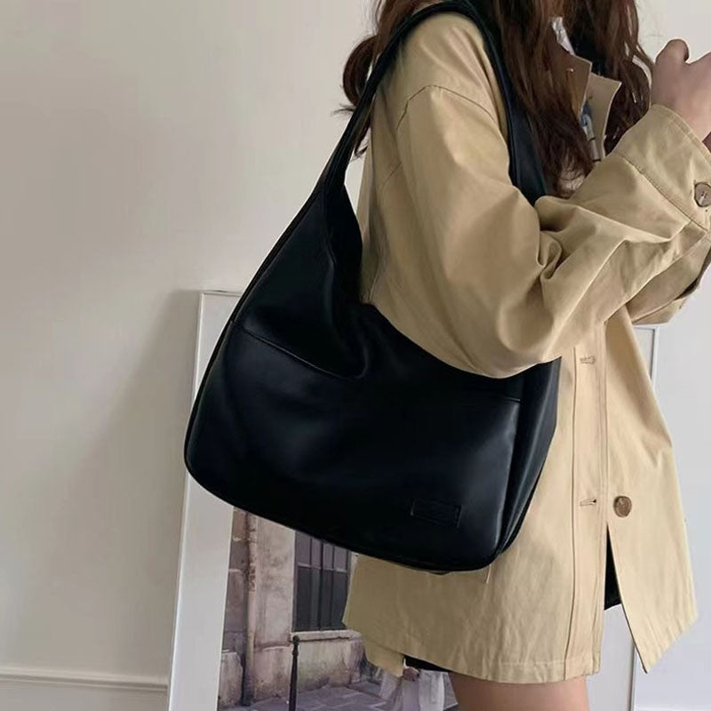 Large capacity tote bag, new black leather simple casual commuting women's bag, fashionable and versatile single shoulder bag