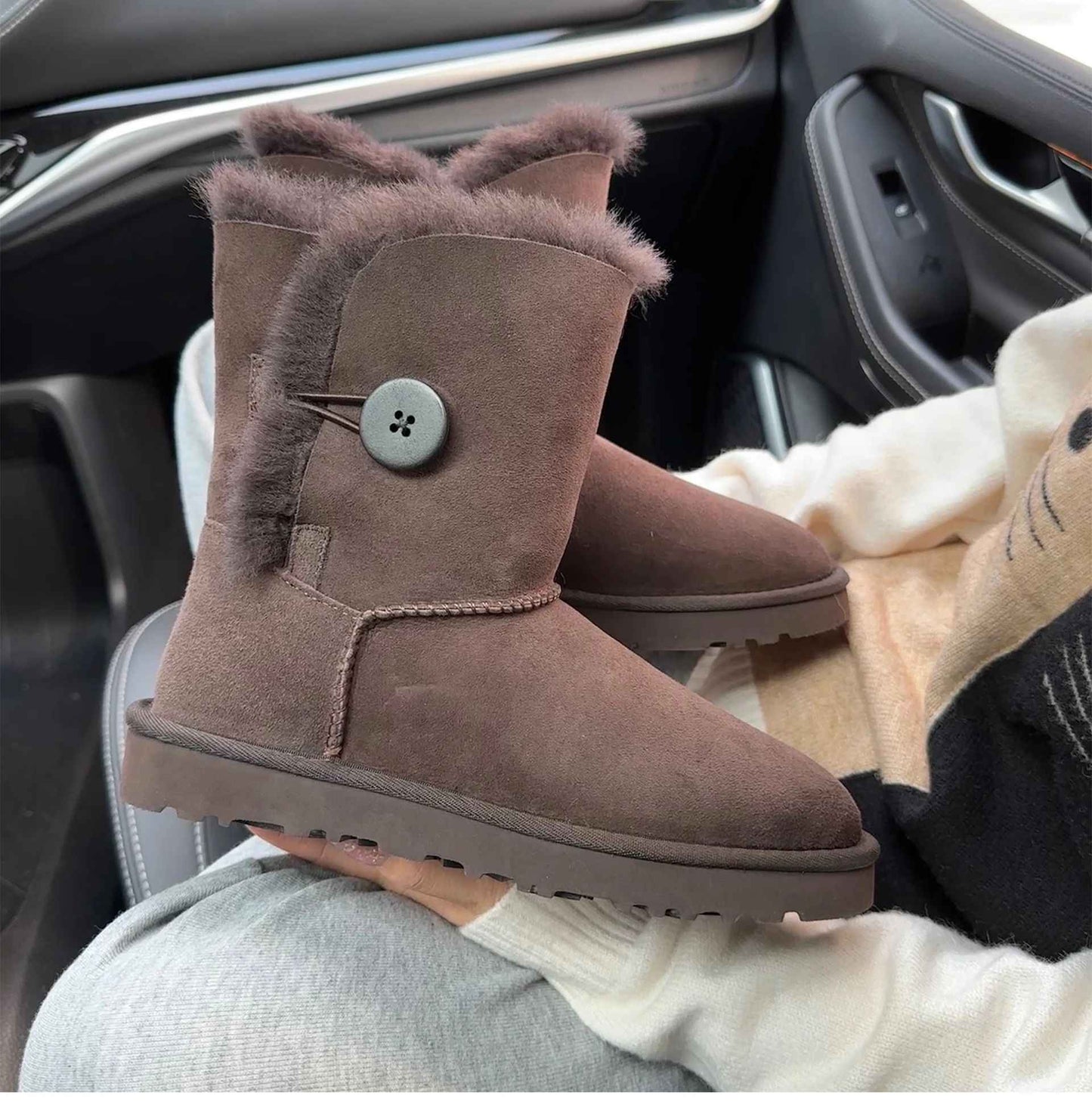 A pair of pure sheepskin and wool winter snow boots for women, warm and comfortable. Simple and fashionable women's shoes