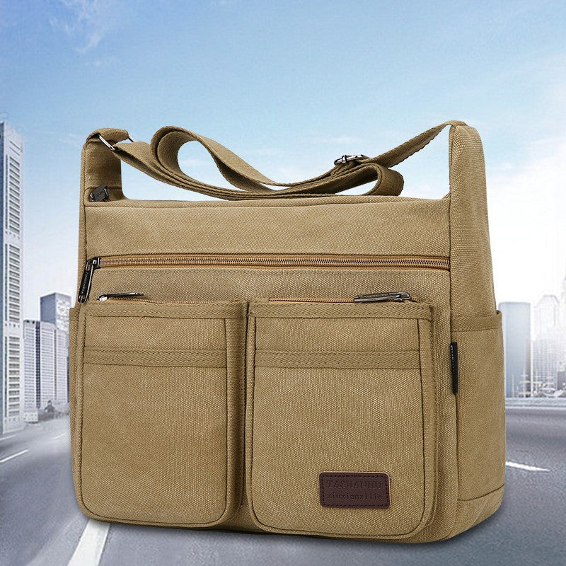 Neutral business casual crossbody bag - adjustable shoulder straps, multiple zippered compartments, durable black polyester lini