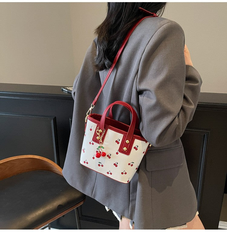 Women PU Cherry Shoulder Bag Large Capacity Trendy Commuting Bag with Cherry Pendant Stylish Crossbody Bag Aesthetic Handbag